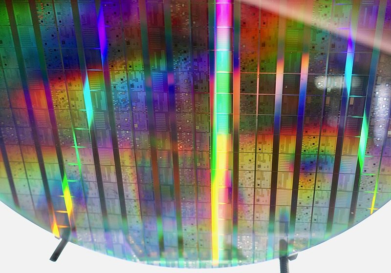 Intel quantum processor wafer showing multiple quantum computing chips before dicing. Intel's silicon-based quantum processors are specifically designed for fault-tolerant quantum error correction. Credit: Wikimedia Commons