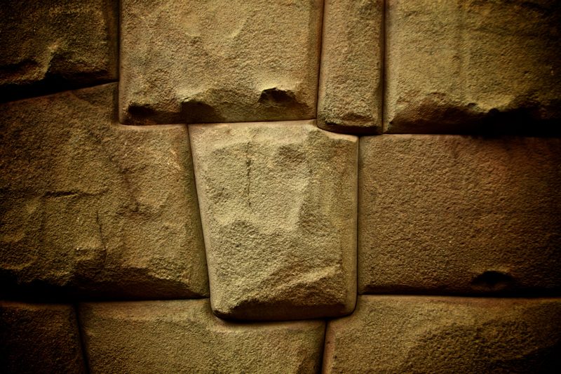 Precision-fitted Inca dry-stone wall at Machu Picchu — granite blocks fitted without mortar